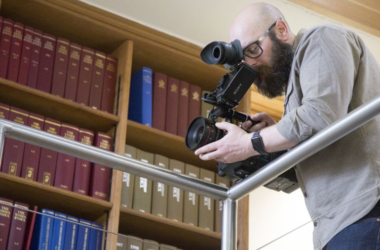 Cameraman filming at the Library